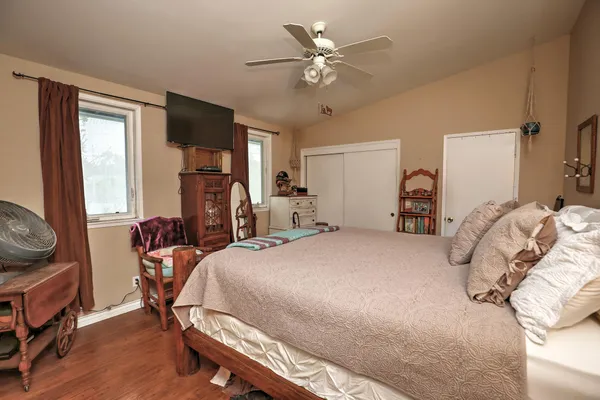 a bed room with a bed and a tv
