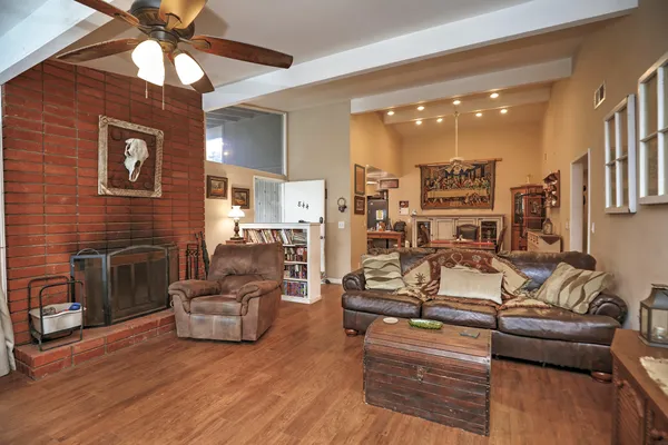 a living room with furniture and a fireplace