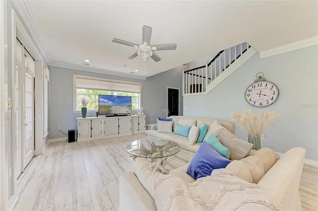 front view of a house with a yard and potted plants