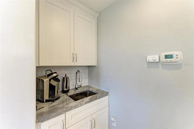 a spacious bedroom with a bed and a fireplace