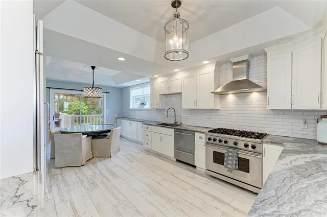a bathroom with a sink a mirror and a window