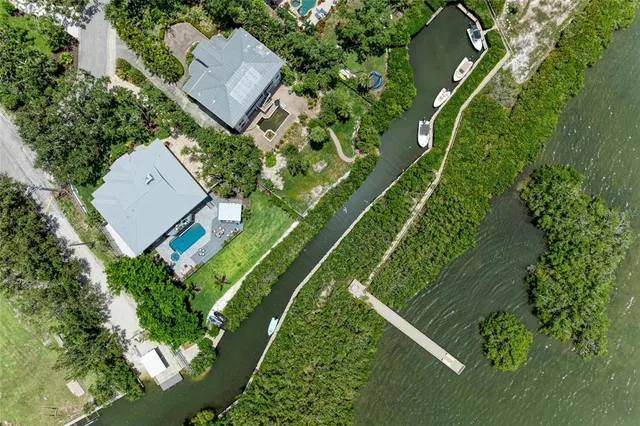 a view of a workspace with furniture and wooden floor