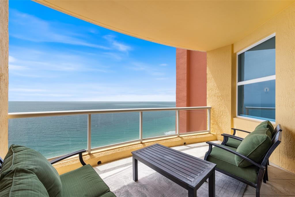 2100 North Ocean Boulevard, Unit 20D Fort Lauderdale, FL 33305 - Photo 1 of 25 a backyard of a house with seating space