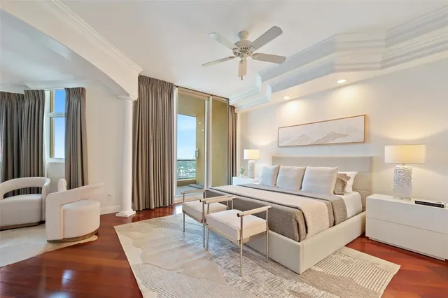 a bedroom with a bed and a couch