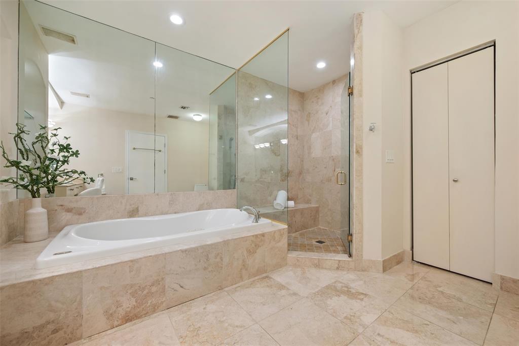 2100 North Ocean Boulevard, Unit 20D Fort Lauderdale, FL 33305 - Photo 18 of 25 a spacious bathroom with a tub shower and sink