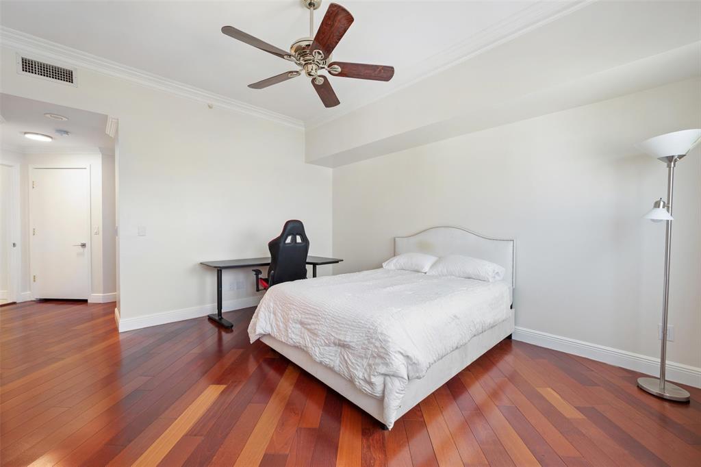 2100 North Ocean Boulevard, Unit 20D Fort Lauderdale, FL 33305 - Photo 22 of 25 a bedroom with a bed and a ceiling fan