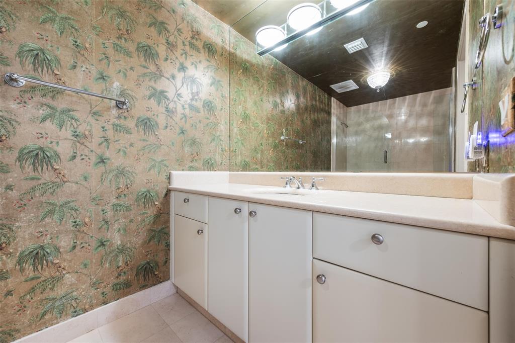 2100 North Ocean Boulevard, Unit 20D Fort Lauderdale, FL 33305 - Photo 24 of 25 a bathroom with a sink and mirror