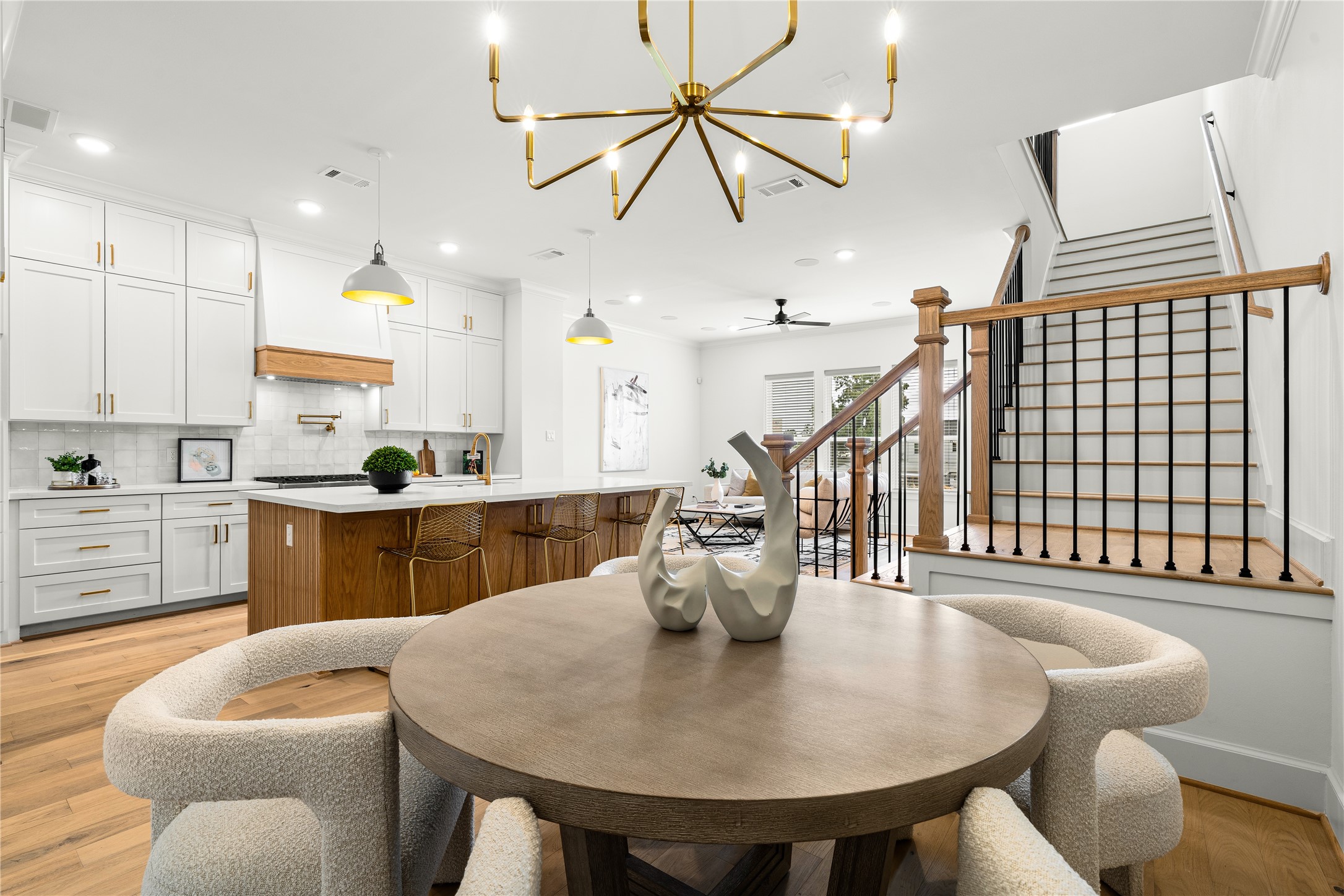 1614 Ojeman Road, Unit E Houston, TX 77055 - Photo 23 of 50 The adjacent dining area offers cozy seating, while the stylish staircase adds a touch of sophistication.