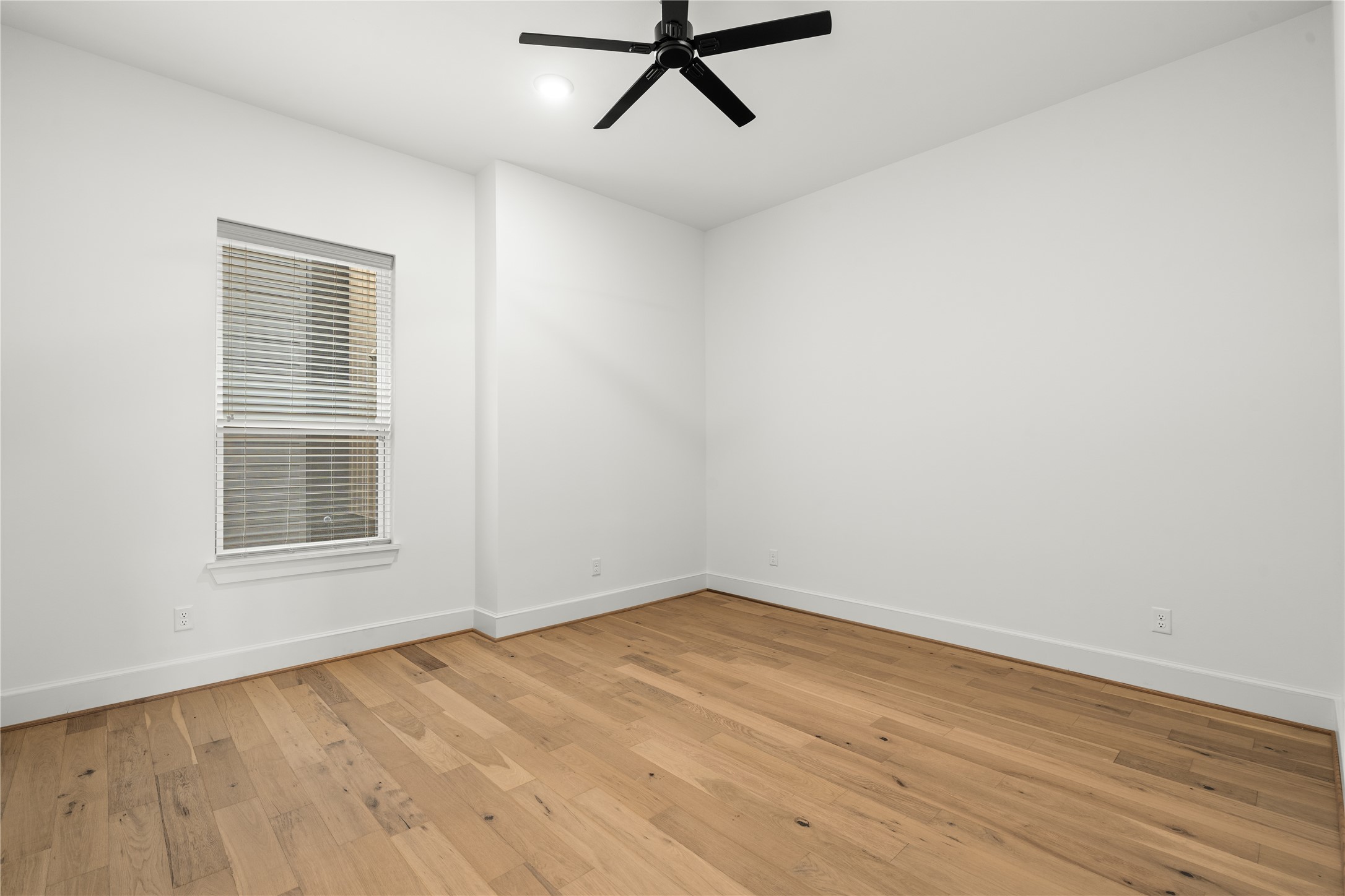 1614 Ojeman Road, Unit E Houston, TX 77055 - Photo 25 of 50 Spacious secondary bedroom on the second floor, perfect for use as a guest room, home office, or flex space to suit your lifestyle needs.