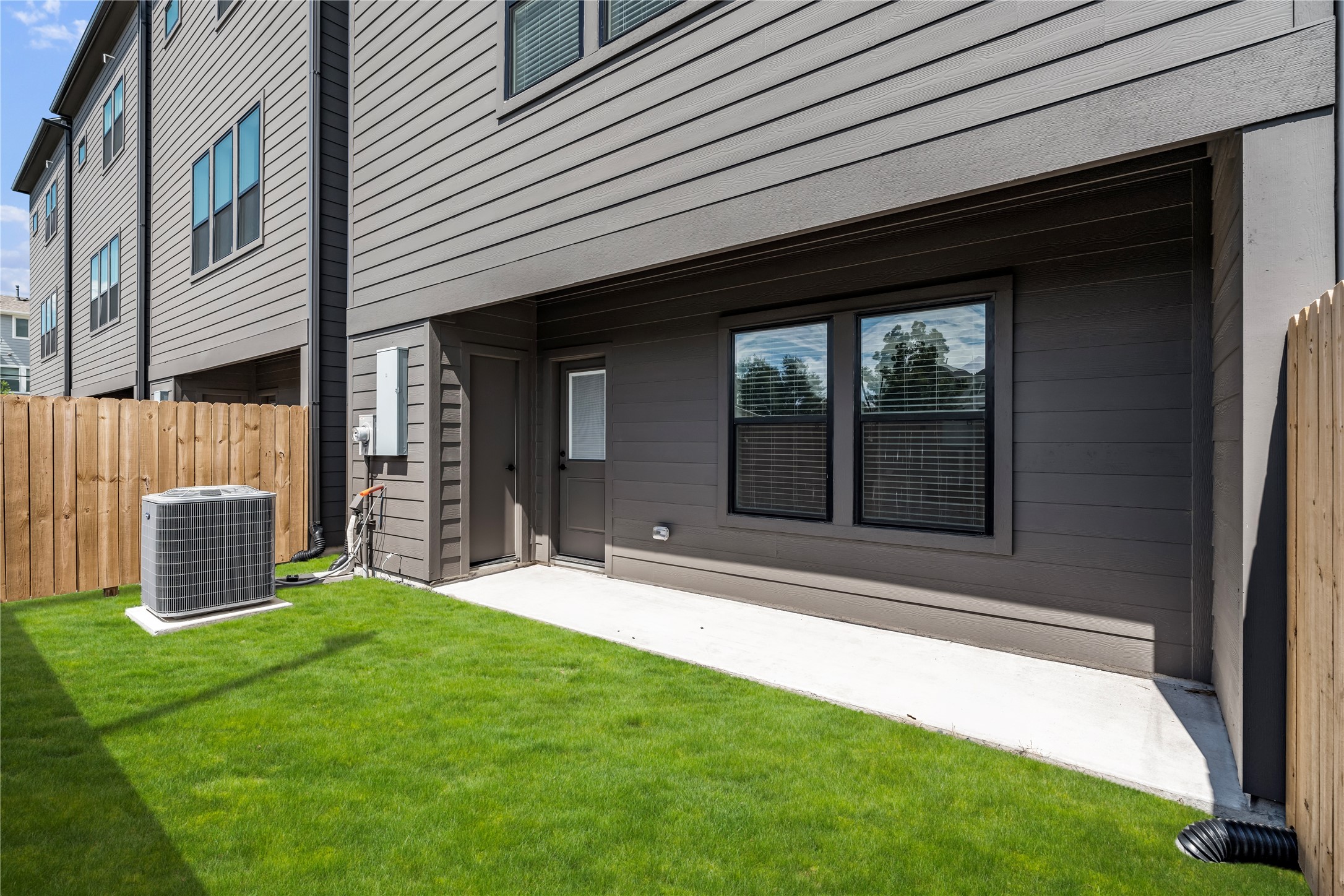 1614 Ojeman Road, Unit E Houston, TX 77055 - Photo 3 of 50 A rare find in the city with a spacious covered backyard featuring an extra storage room - perfect for keeping bikes, holiday décor, or gardening supplies neatly organized while freeing up garage space.