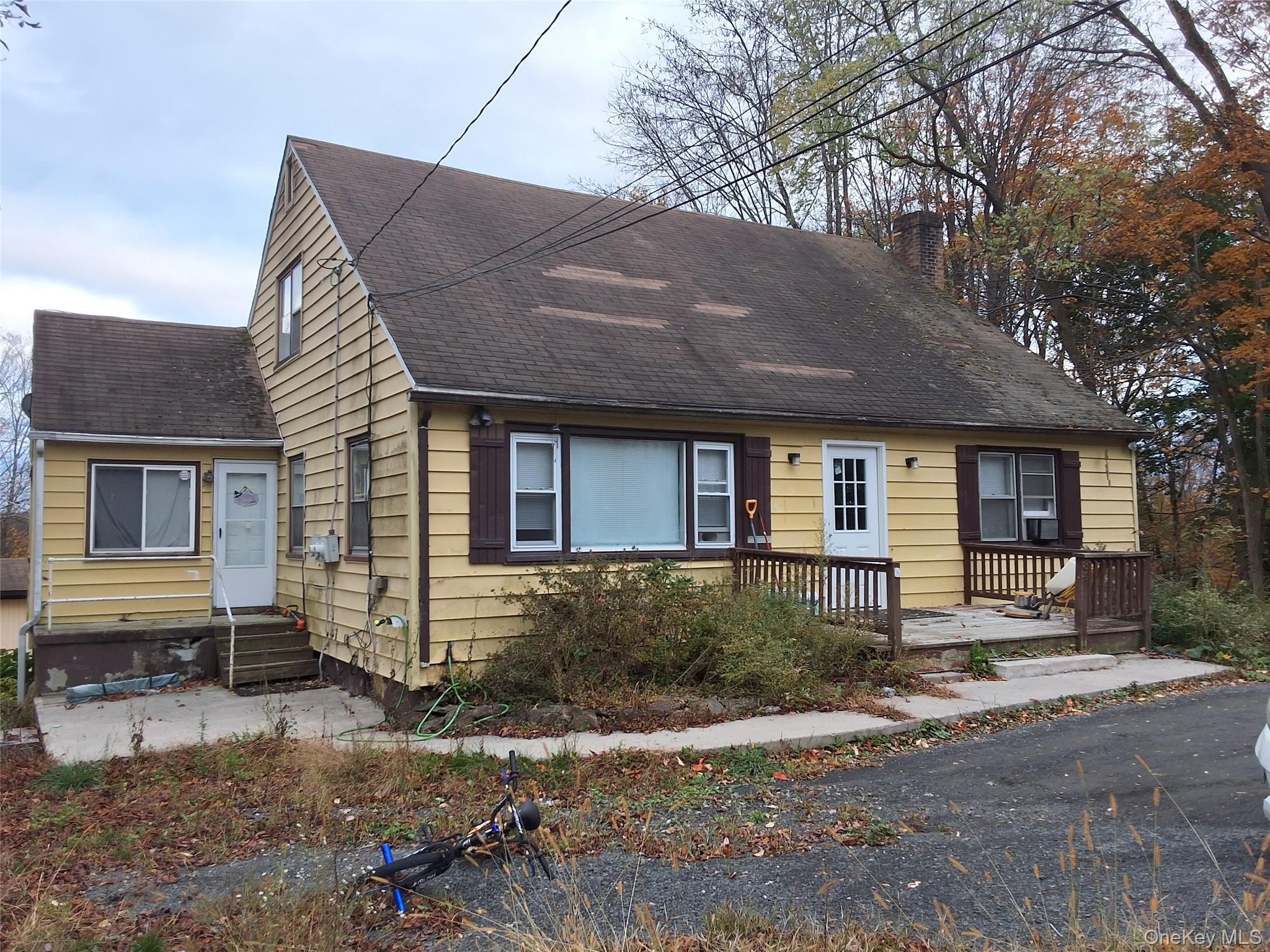 84 North Road Bloomingburg, NY 12721 - Photo 1 of 14 a front view of a house with a yard and garage