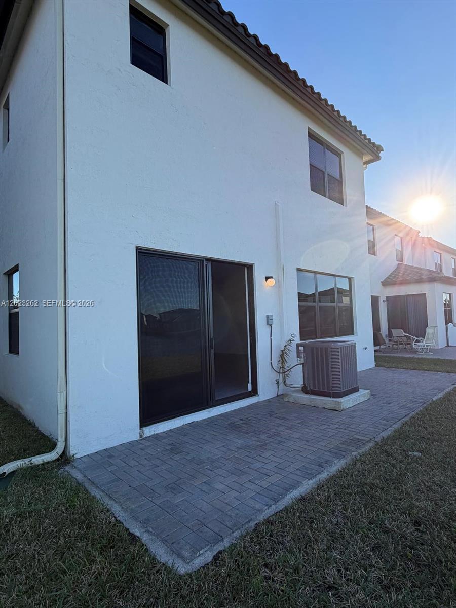 5669 Cerva Lane, Unit 5669 Immokalee, FL 34142 - Photo 9 of 32 a view of a house with a backyard