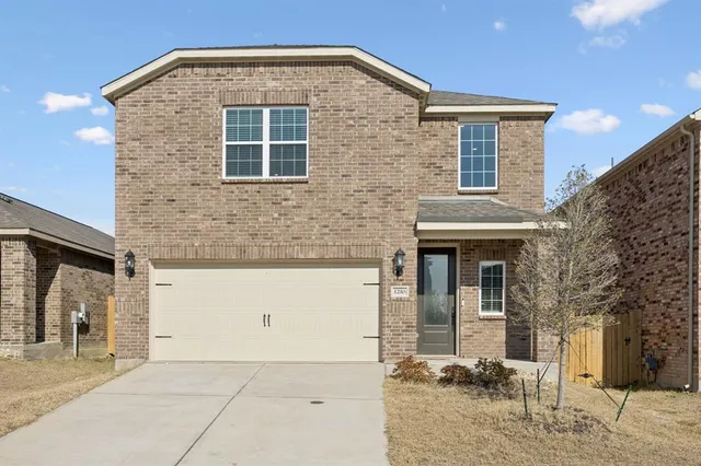 a front view of a house with yard
