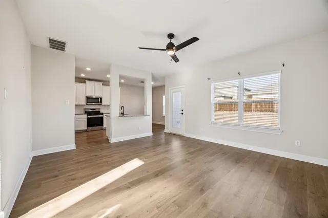 a view of kitchen with furniture and wooden floor