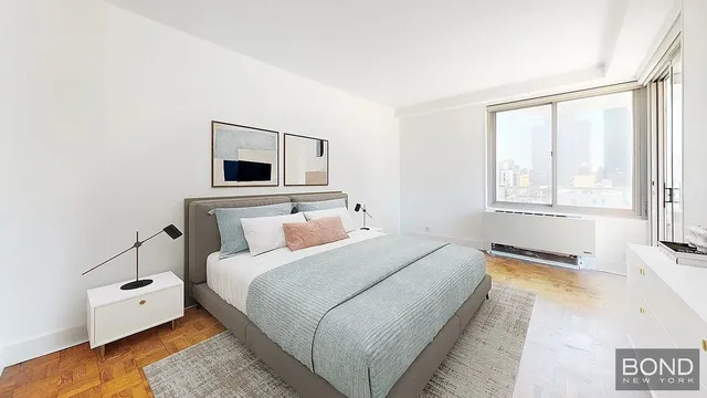 a bedroom with a bed and a window