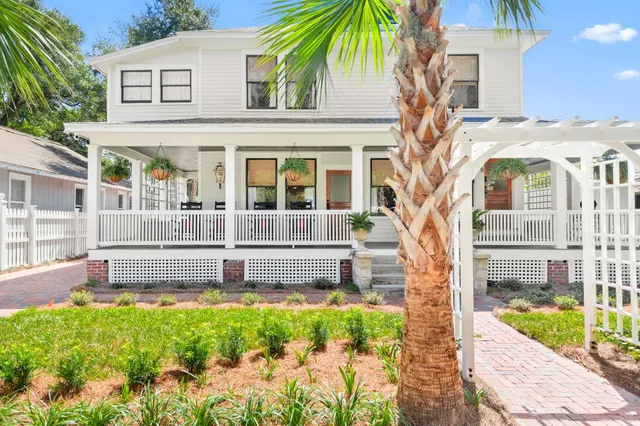 a front view of a house with a yard table and chairs