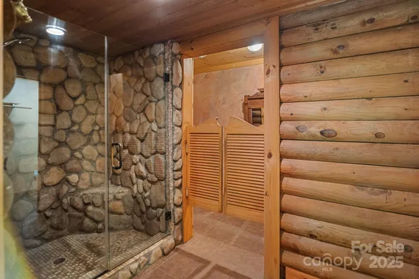 a view of bathroom with a toilet and a shower curtain