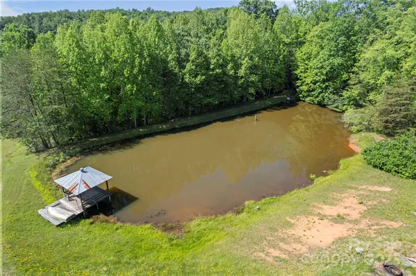 a view of a lake with a yard