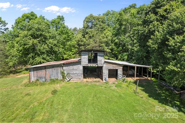 a view of house with backyard and garden
