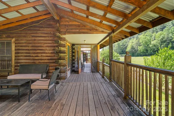 a view of a balcony with wooden floor