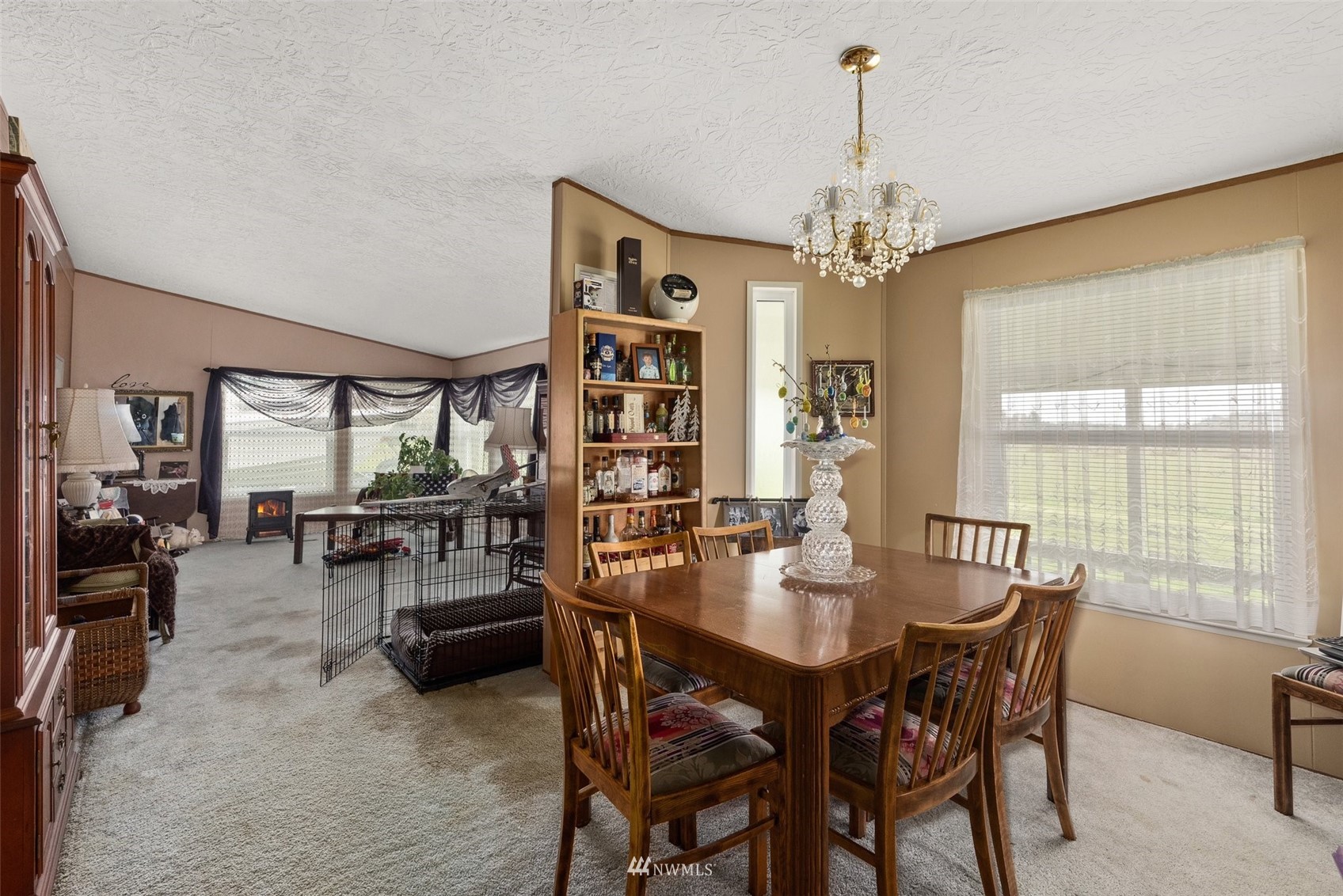 1503 Lincoln Creek Road Rochester, WA 98579 - Photo 21 of 28 a dining room with furniture window and wooden floor