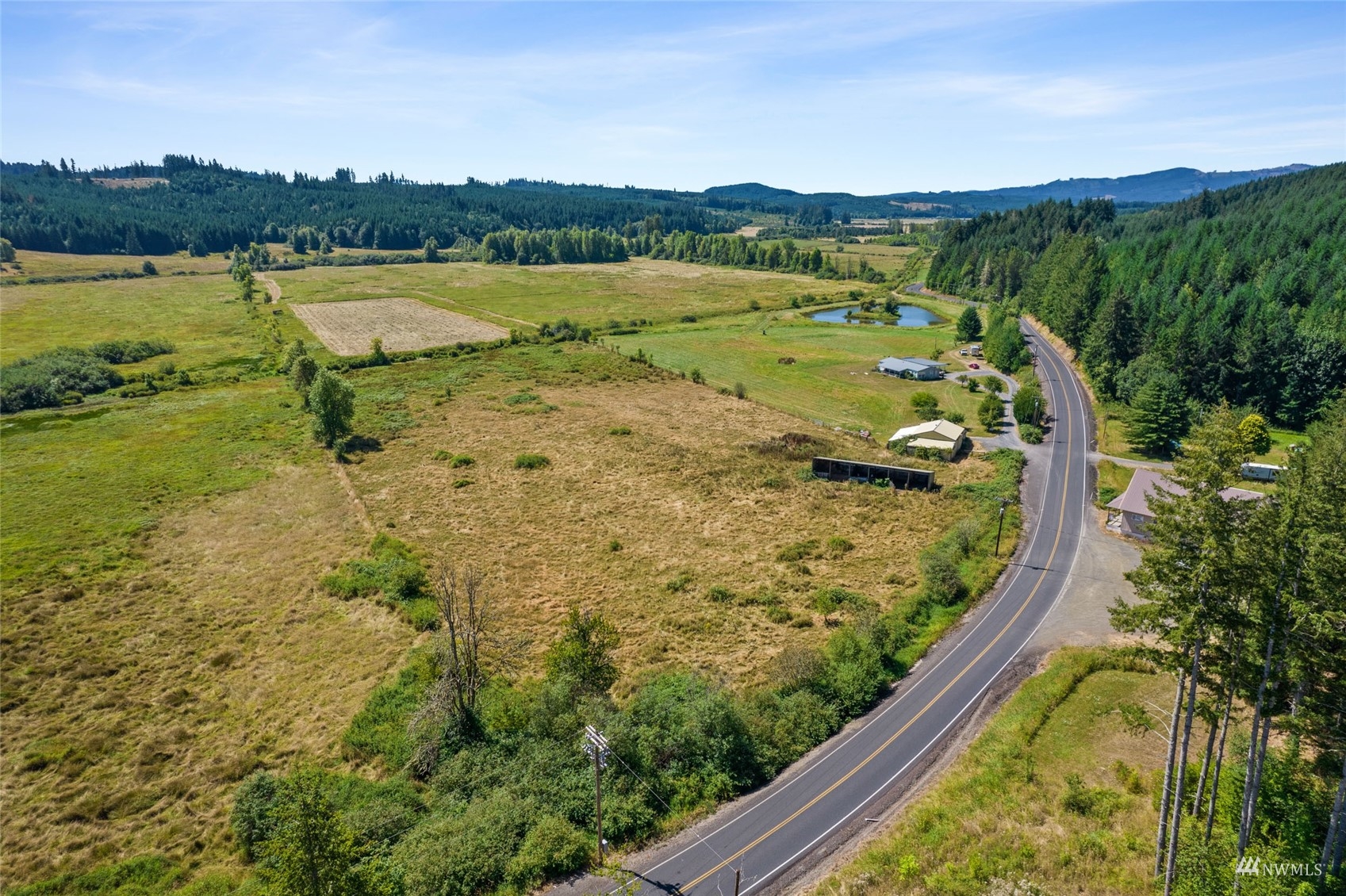 1503 Lincoln Creek Road Rochester, WA 98579 - Photo 5 of 28 a view of a lake with a mountain in the background