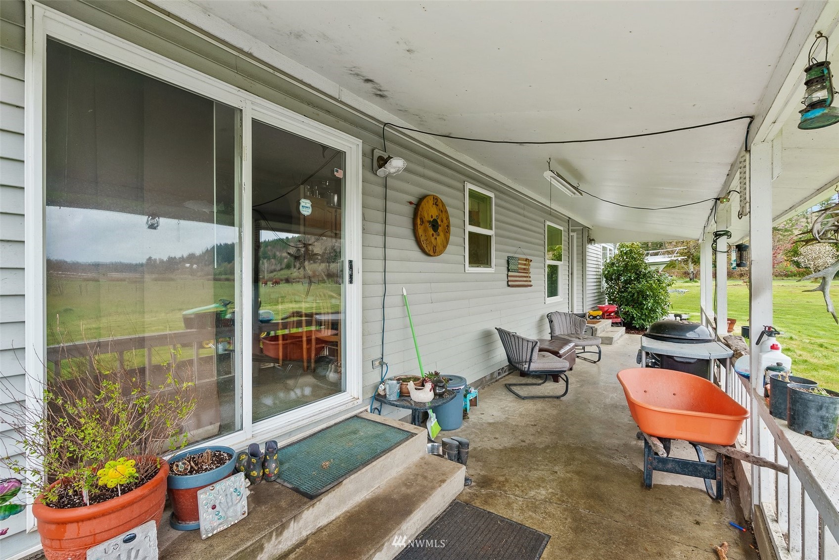 1503 Lincoln Creek Road Rochester, WA 98579 - Photo 6 of 28 a backyard of a house with outdoor seating