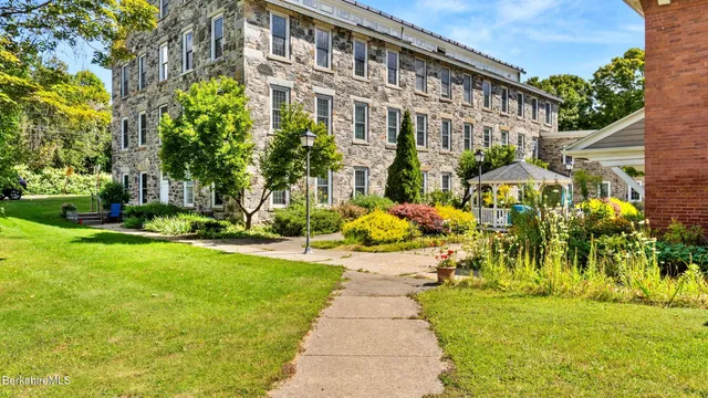 a front view of building with yard