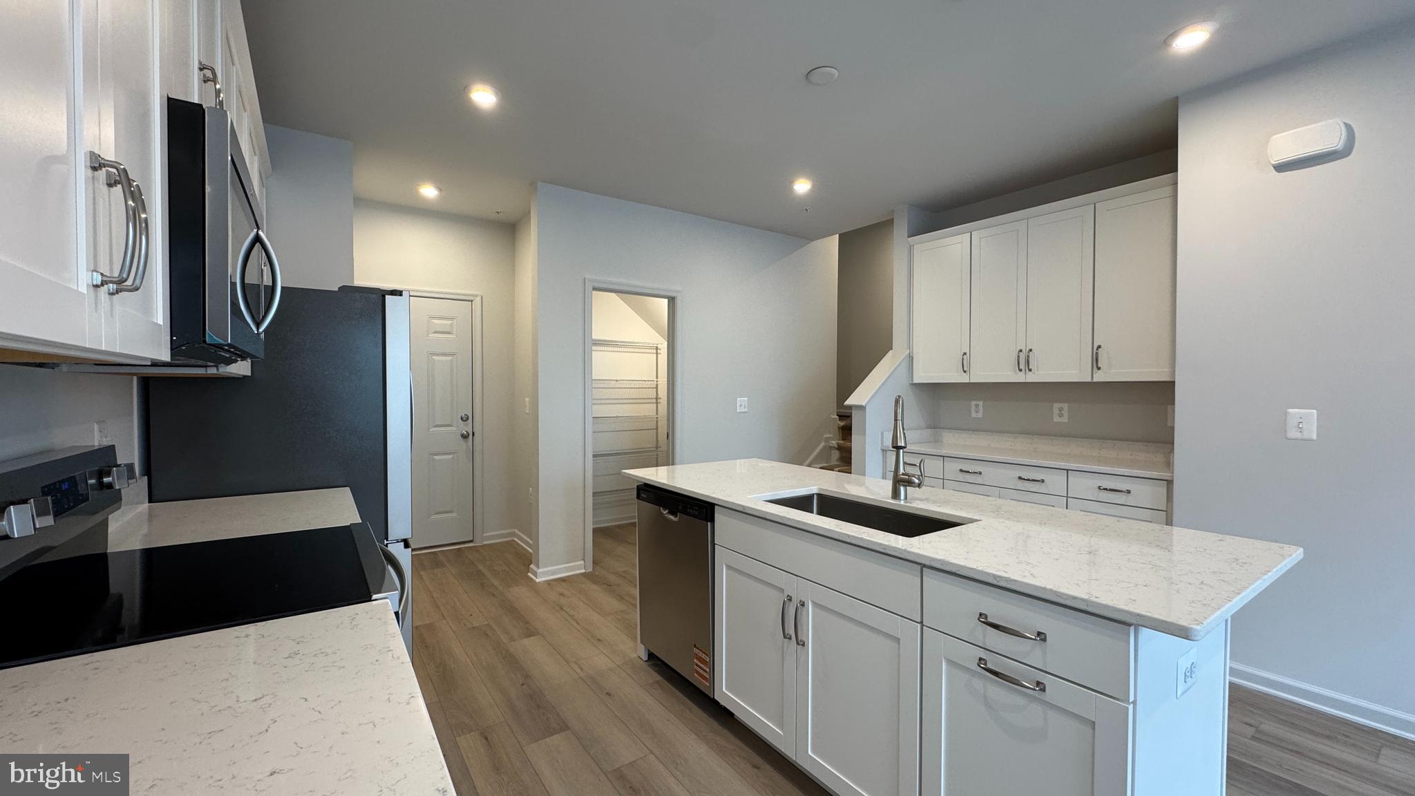 2621 River Birch Road Herndon, VA 20171 - Photo 4 of 10 a kitchen with a sink stove and refrigerator