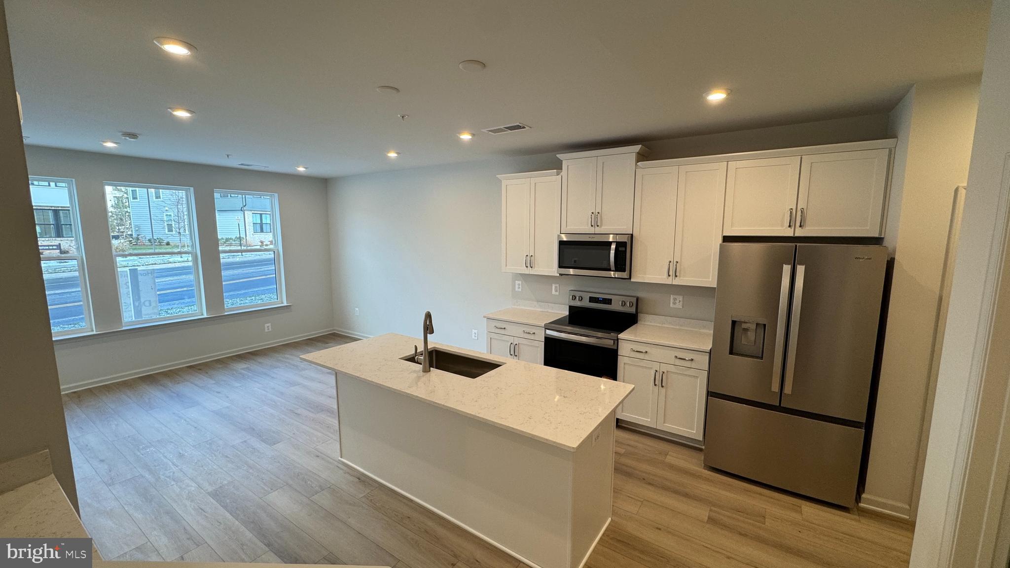 2621 River Birch Road Herndon, VA 20171 - Photo 5 of 10 a kitchen with stainless steel appliances granite countertop a refrigerator a stove a sink dishwasher and a refrigerator with wooden floor