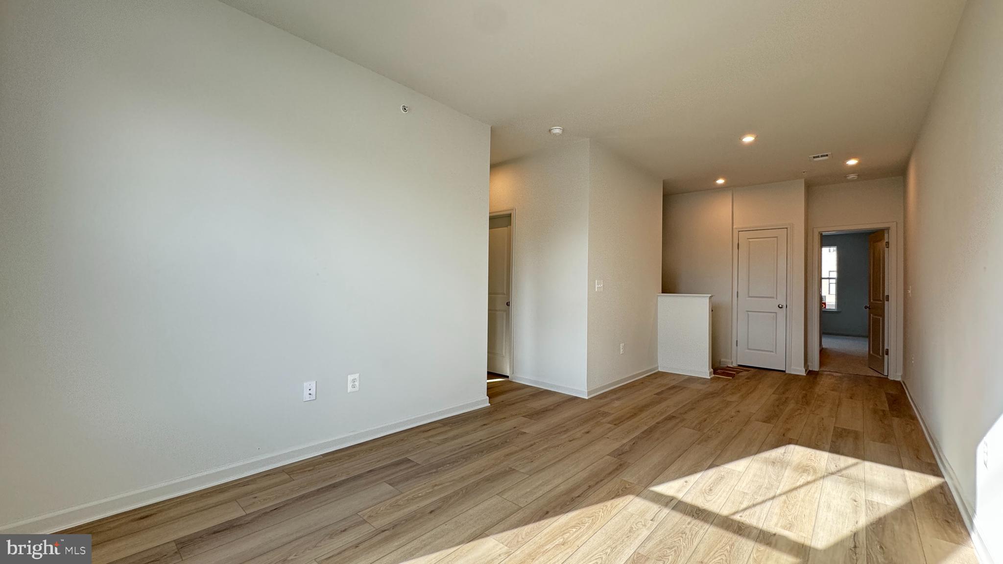 2621 River Birch Road Herndon, VA 20171 - Photo 6 of 10 a view of a big room with wooden floor and windows