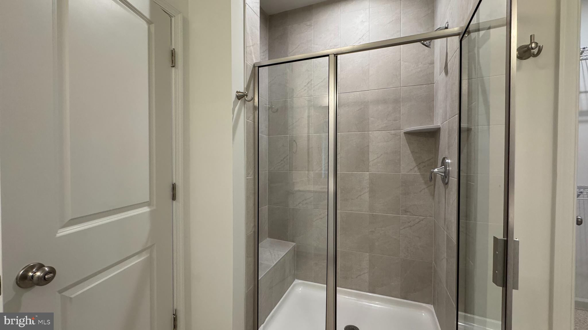 2621 River Birch Road Herndon, VA 20171 - Photo 8 of 10 a bathroom with a glass shower door