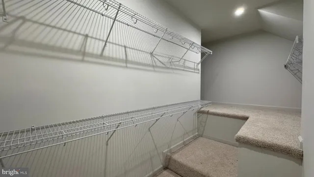 a view of an empty room and a window