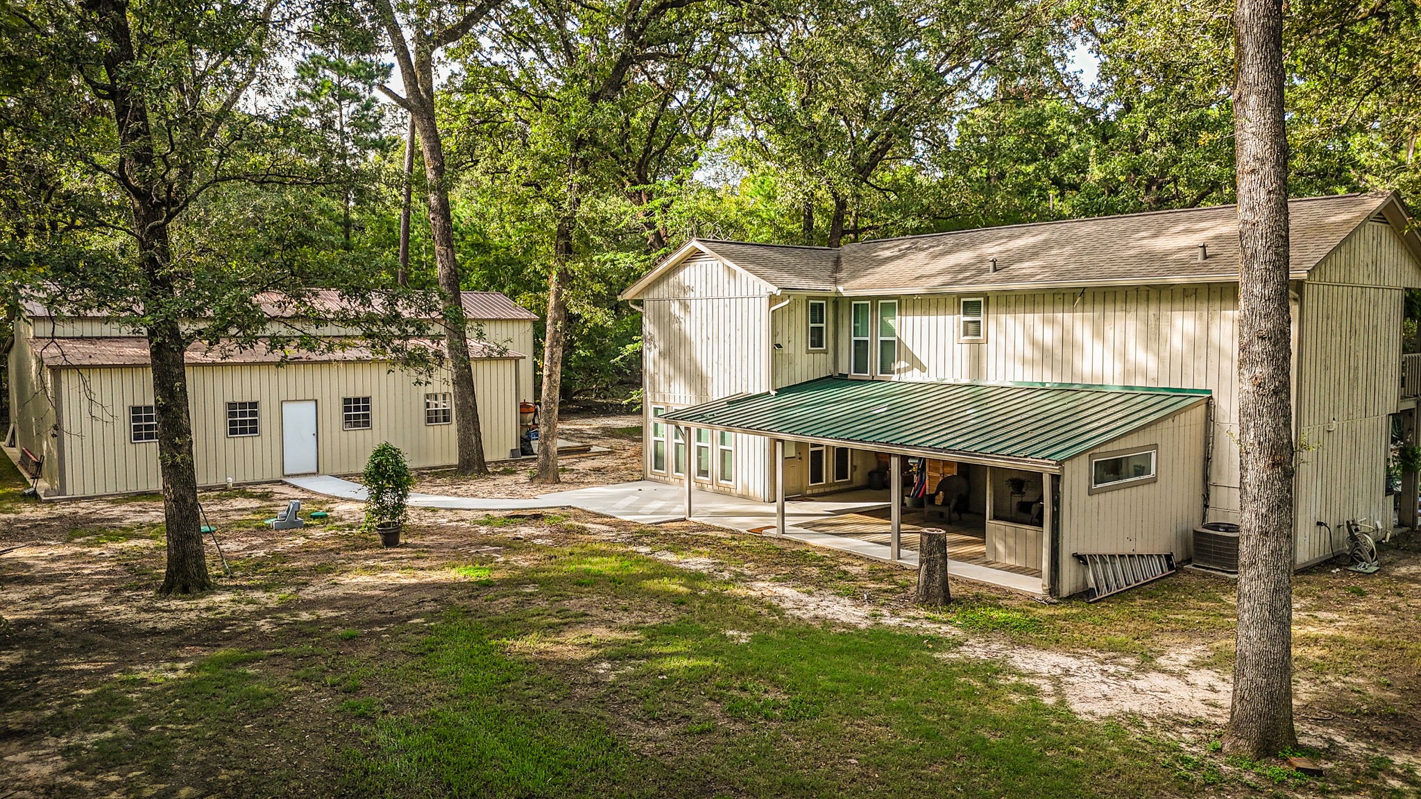 21 Red Oak Circle Point Blank, TX 77364 - Photo 2 of 50 a view of a house with a big yard and large tree