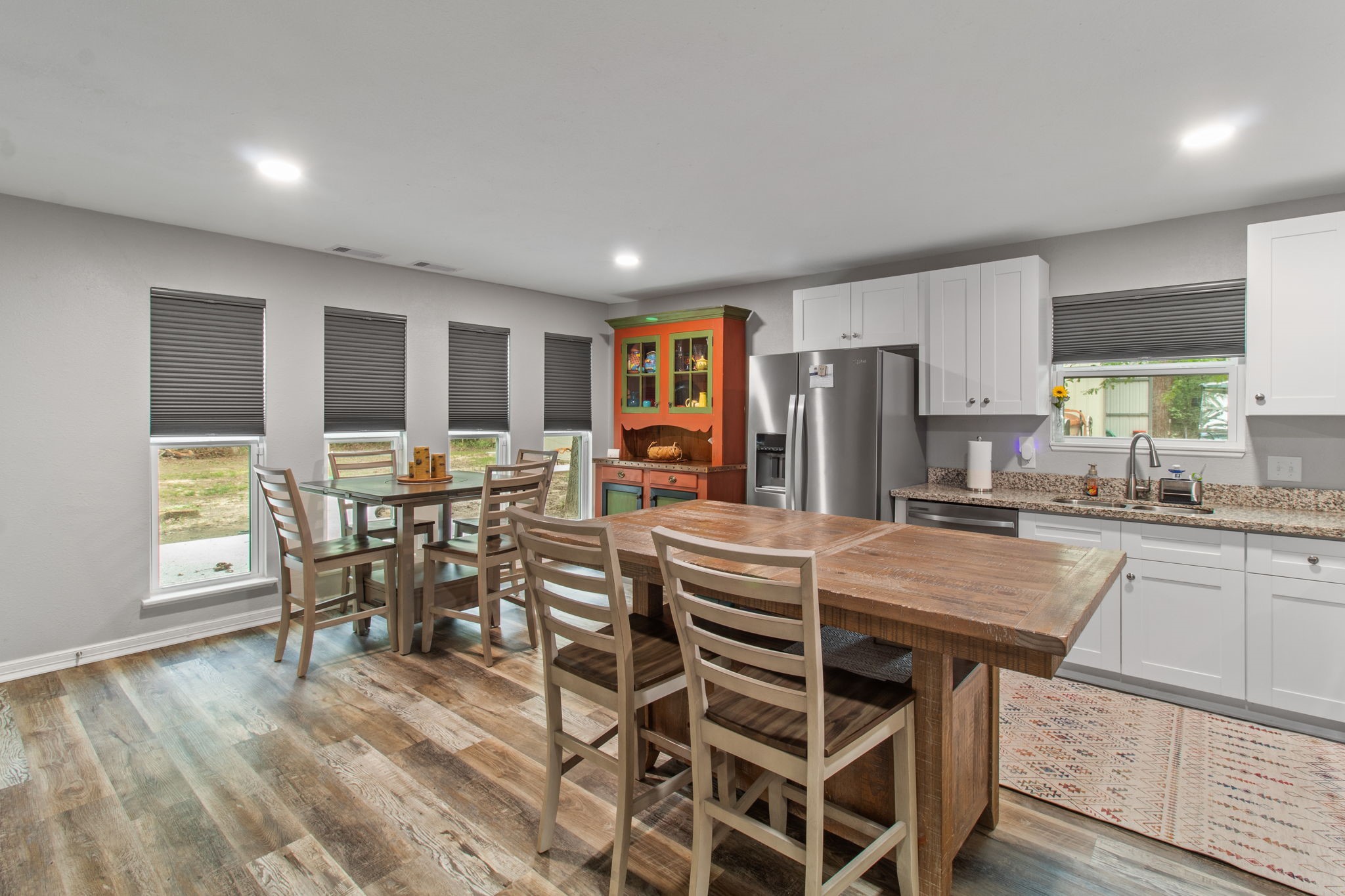 21 Red Oak Circle Point Blank, TX 77364 - Photo 21 of 50 a kitchen with stainless steel appliances a table and chairs in it