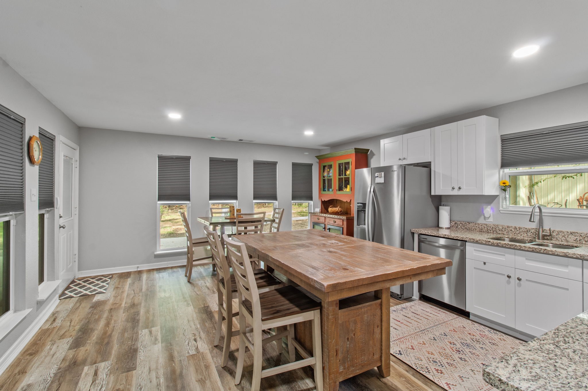 21 Red Oak Circle Point Blank, TX 77364 - Photo 23 of 50 a kitchen with stainless steel appliances granite countertop a table chairs sink refrigerator and cabinets