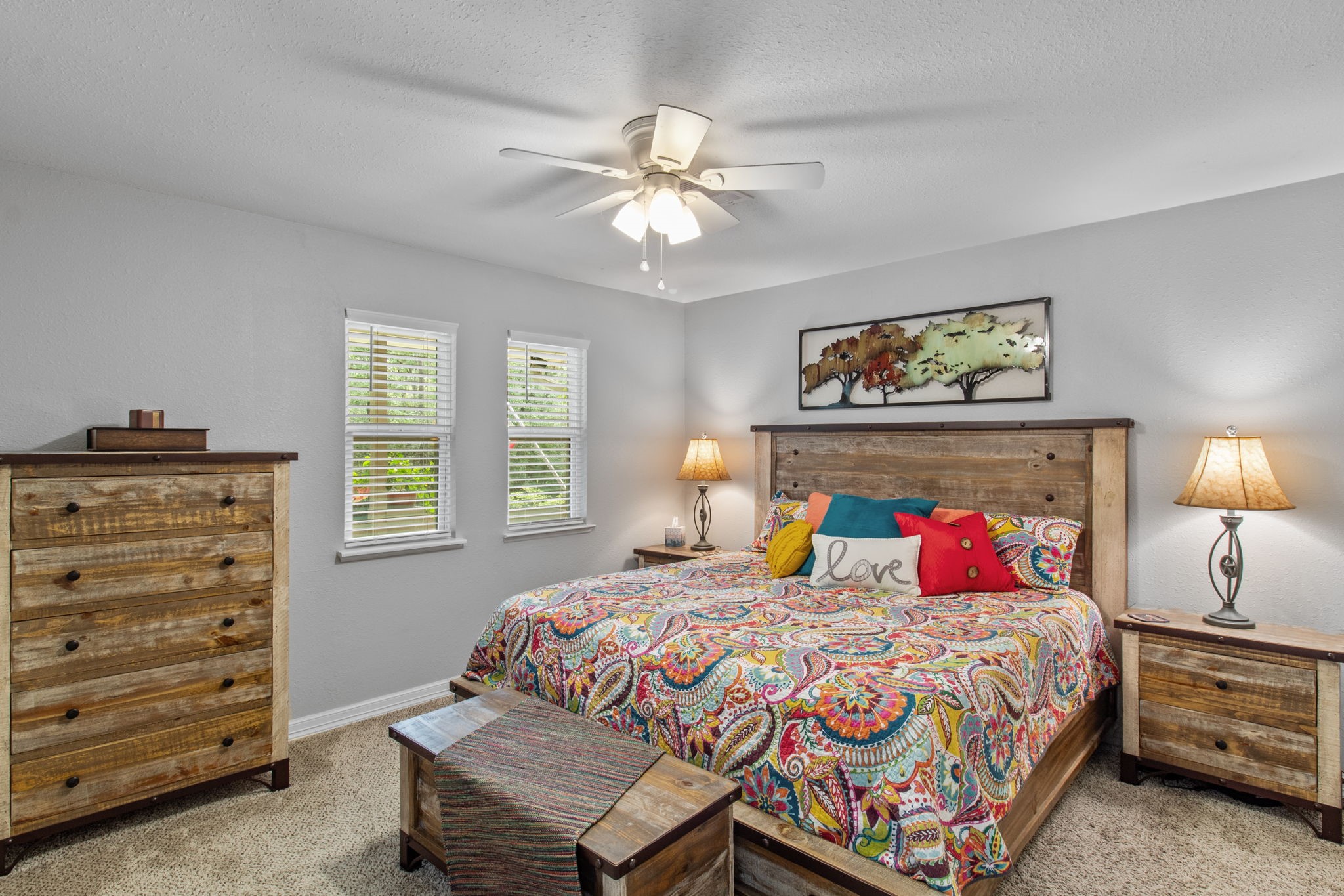 21 Red Oak Circle Point Blank, TX 77364 - Photo 29 of 50 a bedroom with a bed a dresser and a window