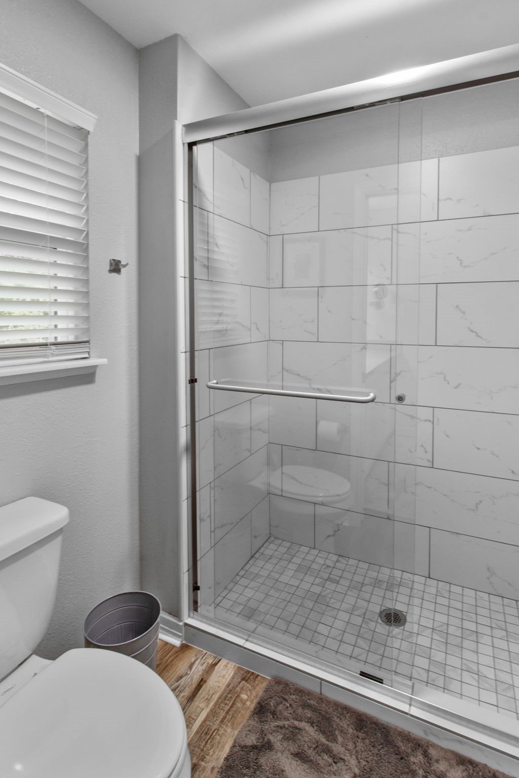 21 Red Oak Circle Point Blank, TX 77364 - Photo 30 of 50 a bathroom with a shower and a toilet