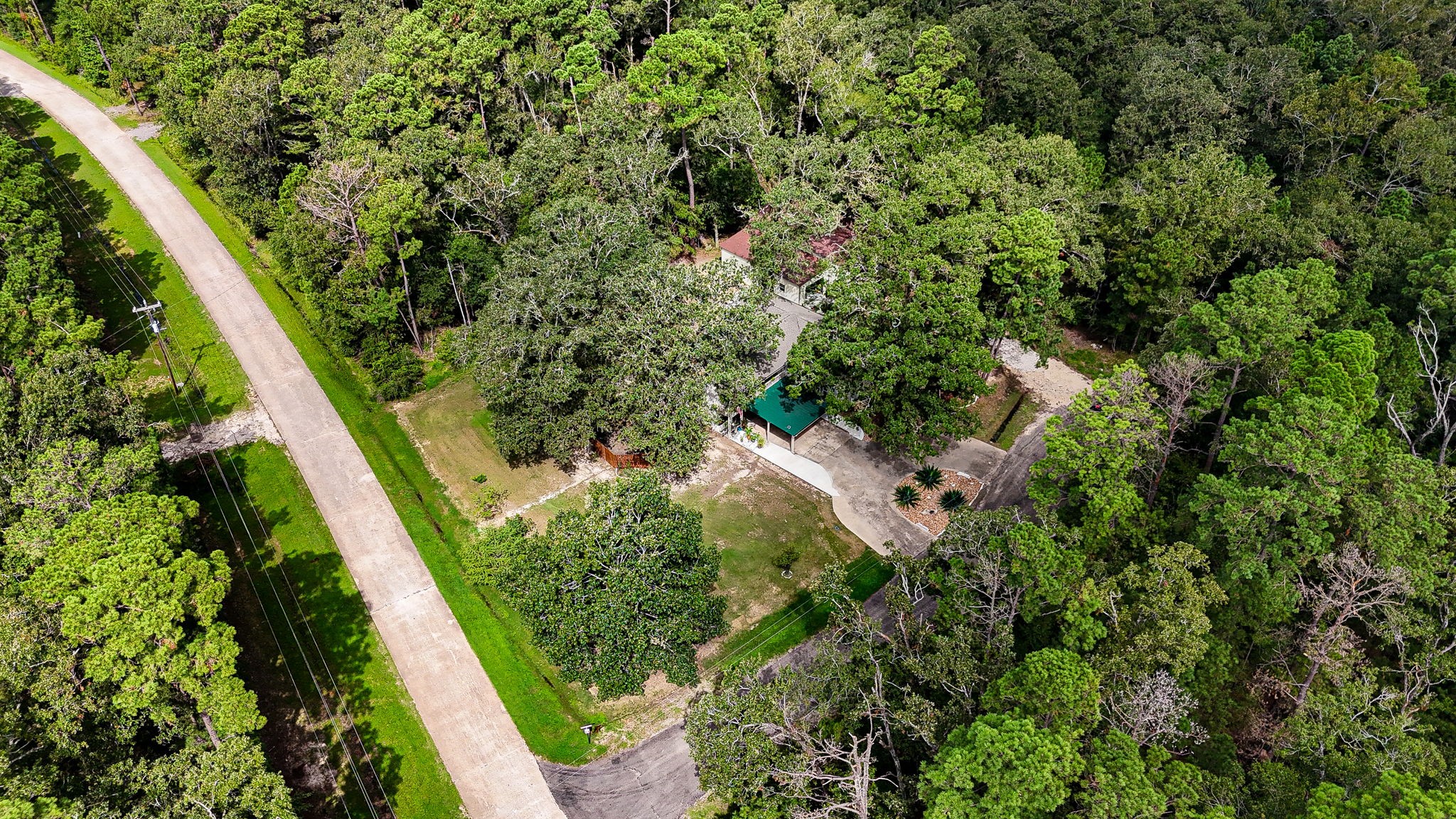 21 Red Oak Circle Point Blank, TX 77364 - Photo 5 of 50 an aerial view of residential house with outdoor space and trees all around