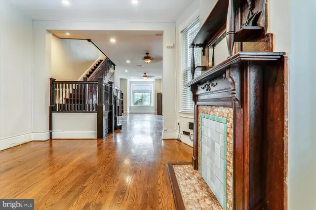 a view of entryway and hall with wooden floor