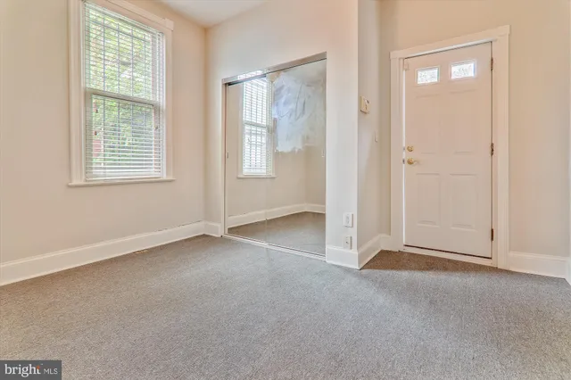 a view of an empty room with a window