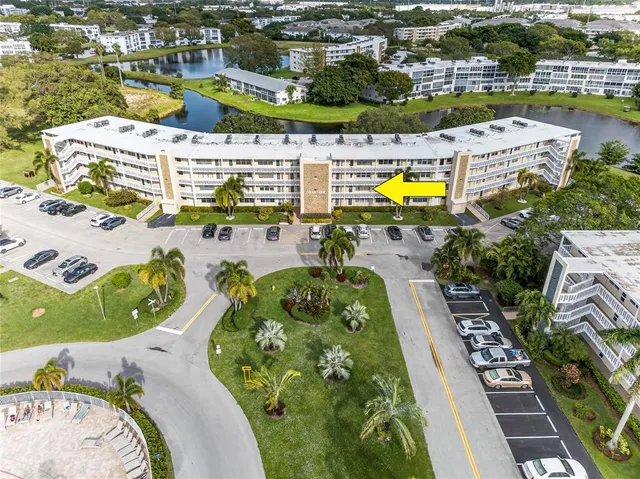 an aerial view of a pool patio swimming pool and outdoor seating