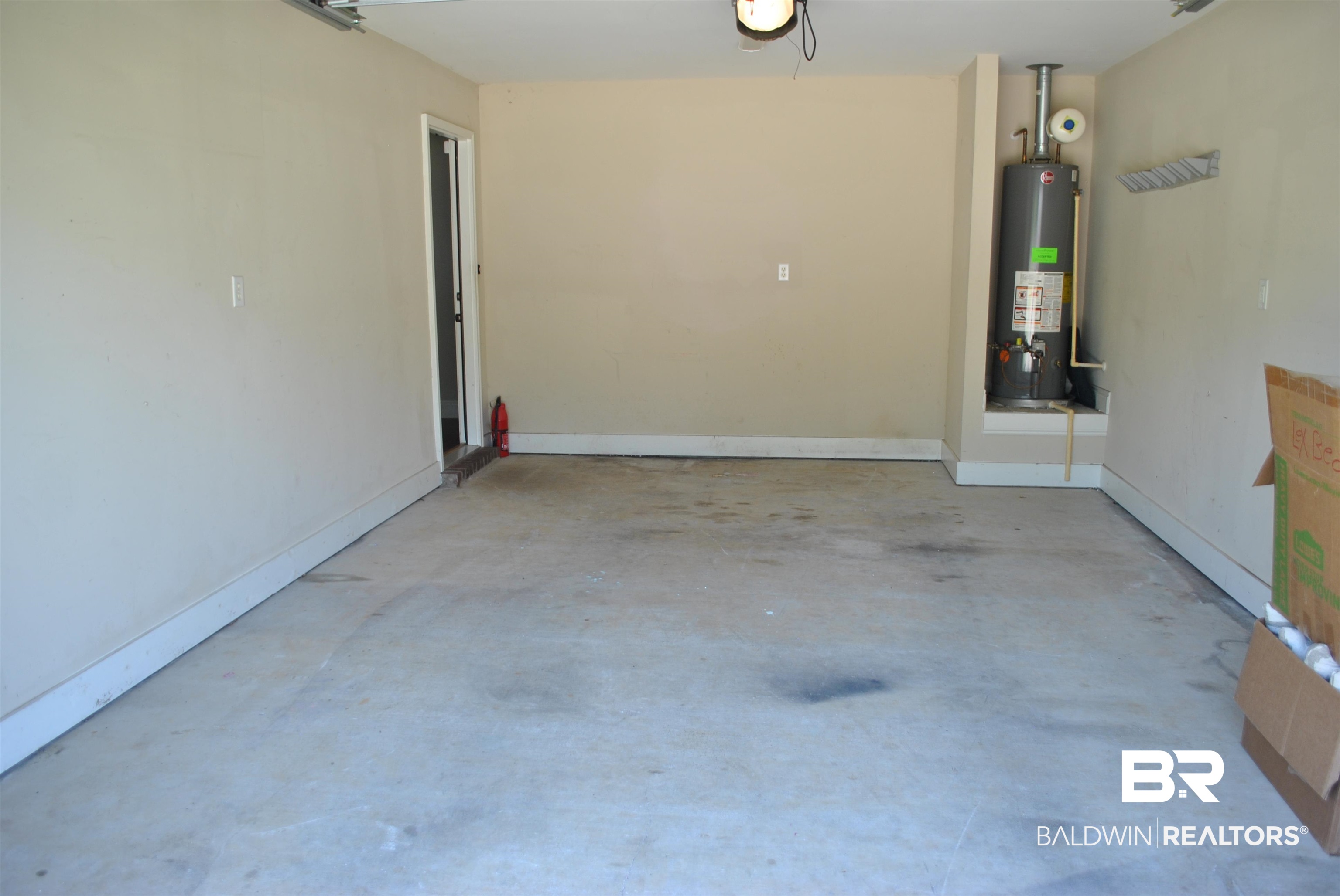 2161 Spring Grove West Mobile, AL 36695 - Photo 31 of 31 Garage with water heater and a garage door opener