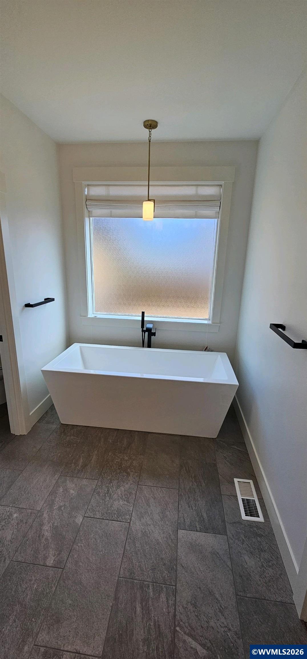 Model B Salishan Street Southeast Salem, OR 97302 - Photo 7 of 30 a bathroom with a bathtub and a window