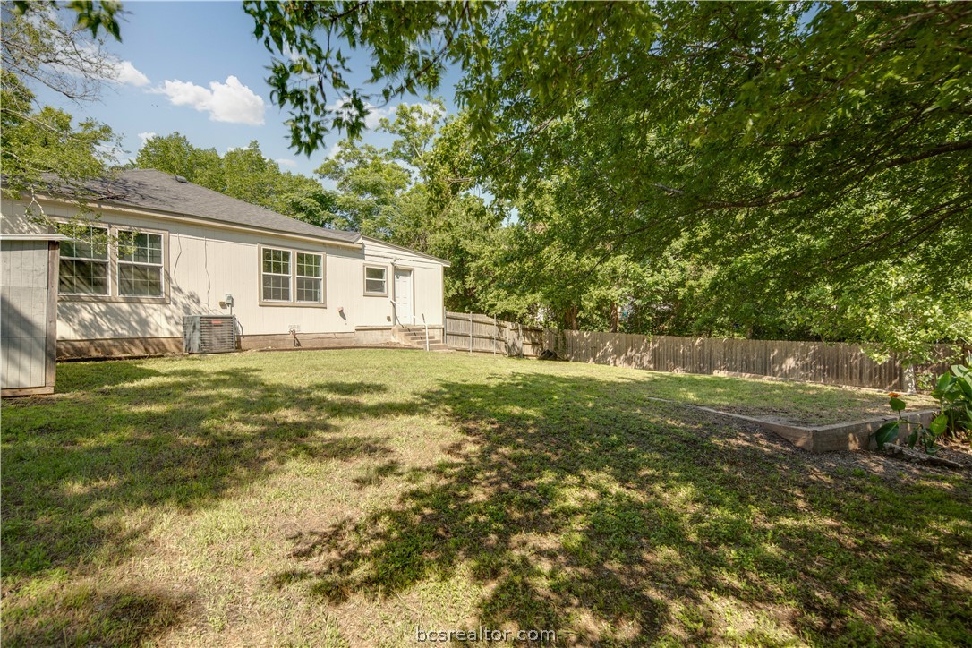 1204 East 28th Street Bryan, TX 77803 - Photo 20 of 22 a view of a house with a yard