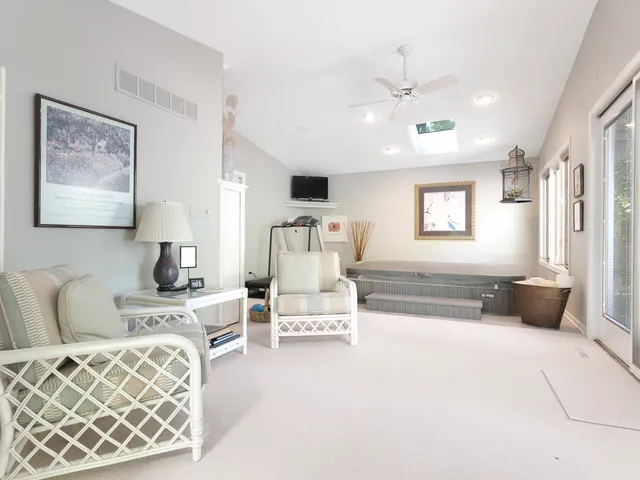 a living room with furniture and white walls
