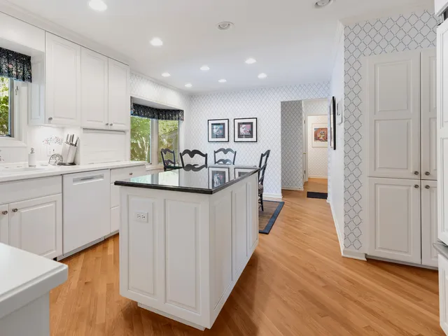 a kitchen with sink stove and cabinets