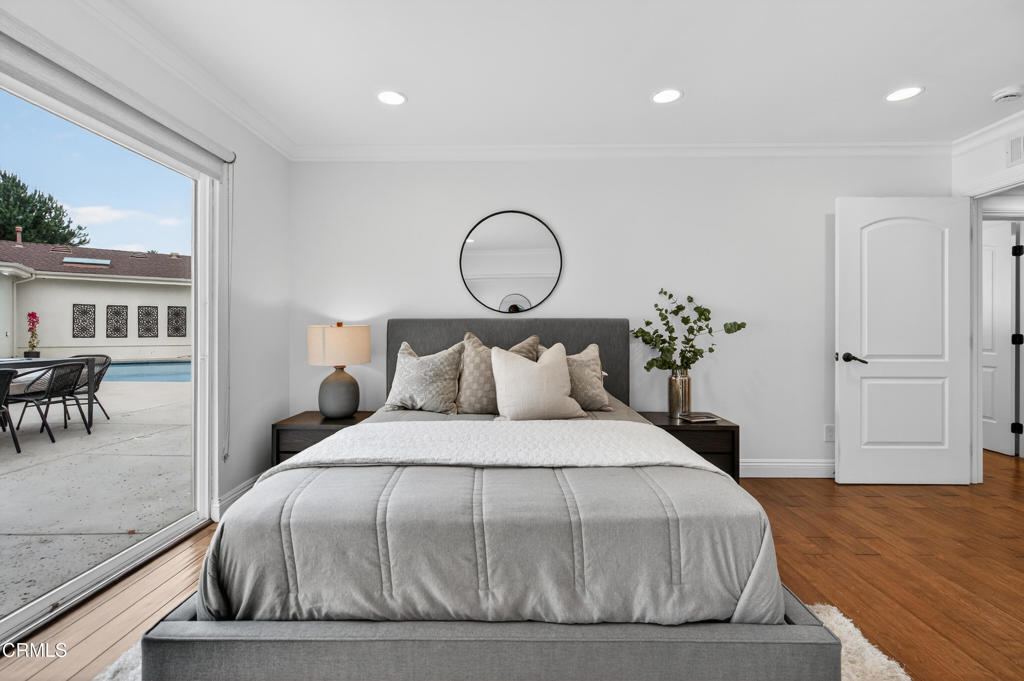 9325 La Shell Drive Tujunga, CA 91042 - Photo 19 of 46 a bedroom with a bed and a potted plant