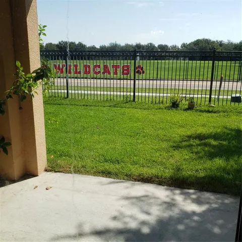a view of a yard with a lake view