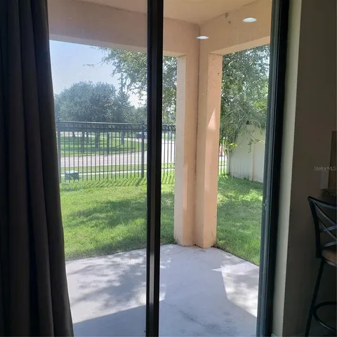 a view of a yard from a balcony
